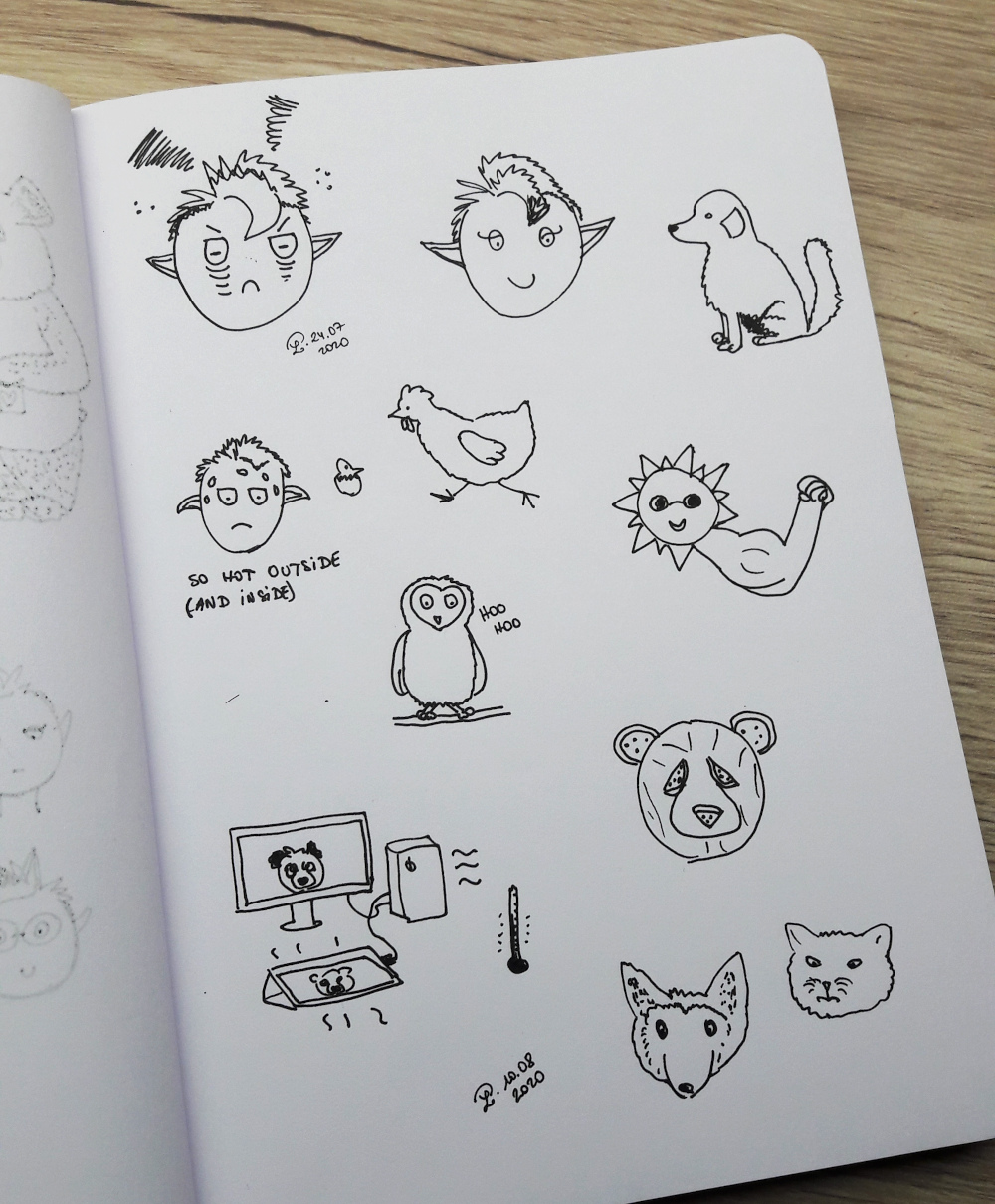 croquis d'animaux au stylo à encre sur un carnet aux pages blanches