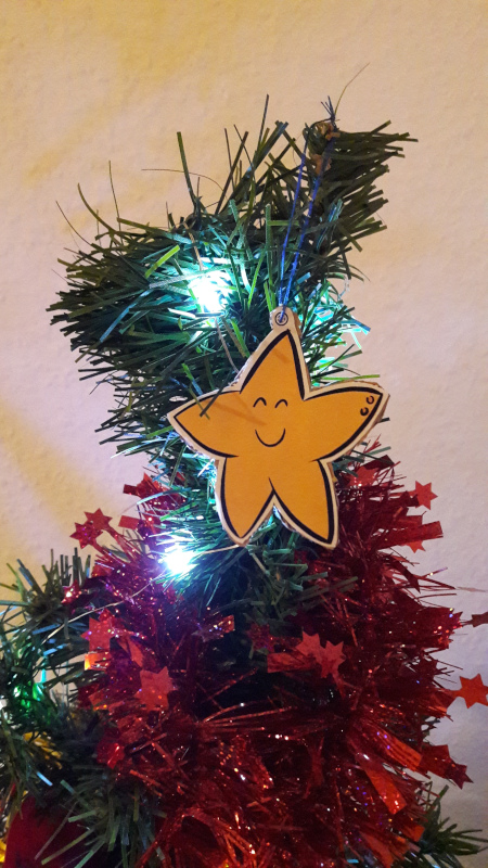 A DIY Christmas decor in star shaped, on a tree