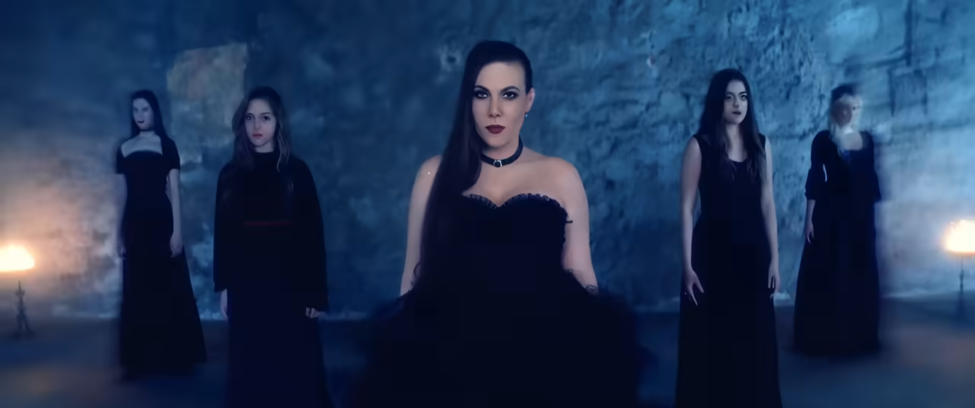 screenshot of the clip "Damnation Flame", with the female singer on the foreground